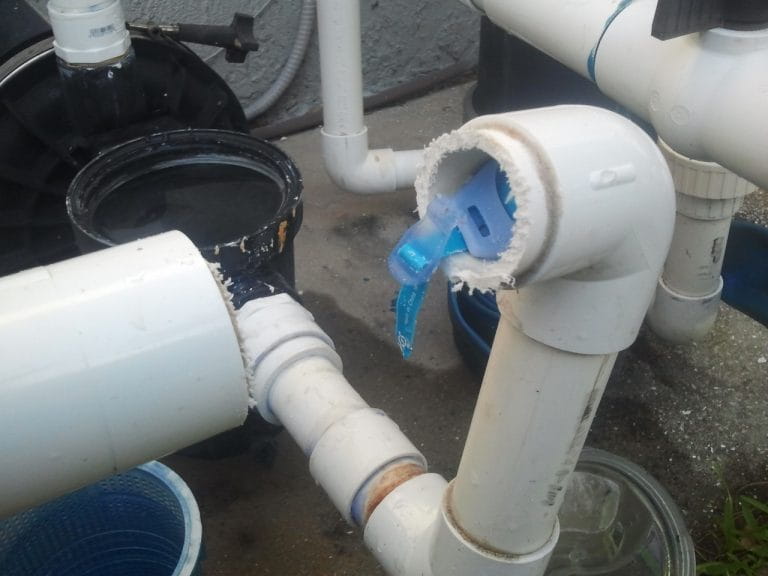 Objects lodged in pool plumbing can restrict water flow and require professional removal.